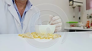 Pharmacist preparing gelatinous oil capsules