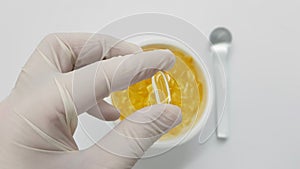 Pharmacist preparing gelatinous oil capsules