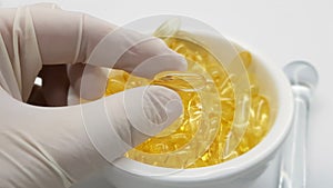 Pharmacist preparing gelatinous oil capsules