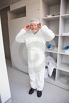 Pharmacist putting on his hairnet photo