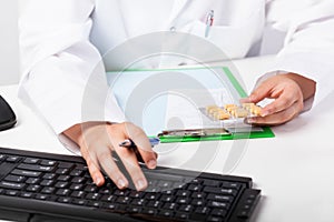 Pharmacist's hands realizing prescription photo