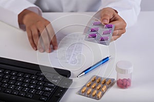 Pharmacist's hands during realizing prescription