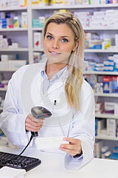 Pharmacist scanning medicines