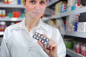 Pharmacist selling medicine