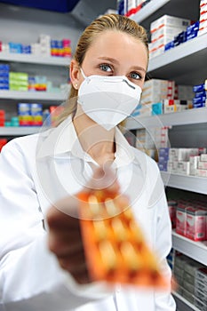 Pharmacist selling medicine