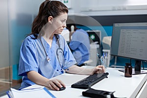 Pharmacist specialist nurse analyzing medical examination using computer