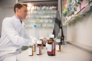 Pharmacist using computer at desk