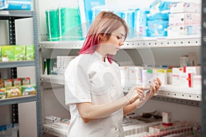 Pharmacist woman in the storage