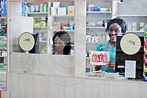Pharmacist working in drugstore at hospital pharmacy. African healthcare
