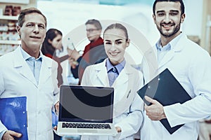 Pharmacists Posing with Laptop