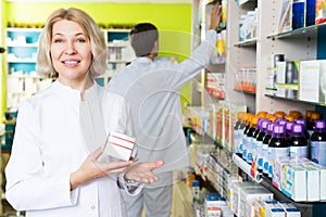 Pharmacists working in modern farmacy photo