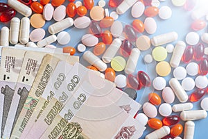 Pharmacy background. Business finance. Russian money and pills on blue backgrouind.