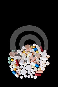 Pharmacy background on a dark table. Levitation pills. Tablets on a dark background which falling down. Pills. Medicine and