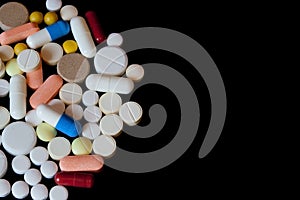 Pharmacy background on a dark table. Levitation pills. Tablets on a dark background which falling down. Pills. Medicine and