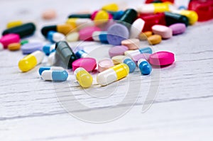 Pharmacy background on a white table. Tablets on a white background. Pills. Medicine and healthy. Close up of capsules. Differend