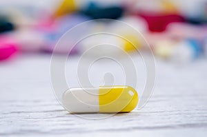Pharmacy background on a white table. Tablets on a white background. Pills. Medicine and healthy. Close up of capsules. Differend