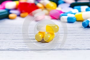 Pharmacy background on a white table. Tablets on a white background. Pills. Medicine and healthy. Close up of capsules. Differend