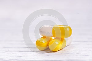 Pharmacy background on a white table. Tablets on a white background. Pills. Medicine and healthy. Close up of capsules. Differend