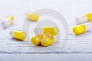 Pharmacy background on a white table. Tablets on a white background. Pills. Medicine and healthy. Close up of capsules. Differend