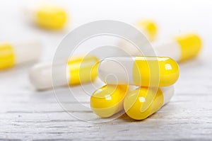 Pharmacy background on a white table. Tablets on a white background. Pills. Medicine and healthy. Close up of capsules. Differend