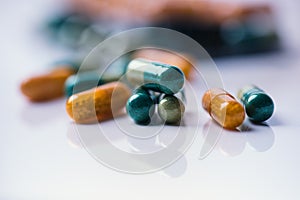 Pharmacy background on a white table. Tablets on a white background. Pills. Medicine and healthy. Close up of capsules. Different