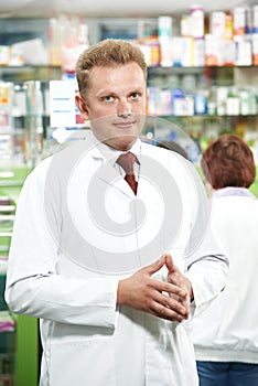 Pharmacy chemist man in drugstore