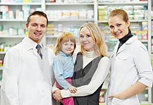 Pharmacy chemist, mother and child in drugstore photo