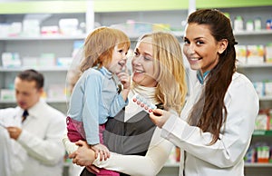 Pharmacy chemist, mother and child in drugstore