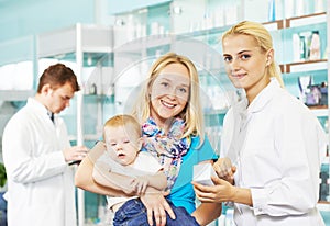 Pharmacy chemist, mother and child in drugstore