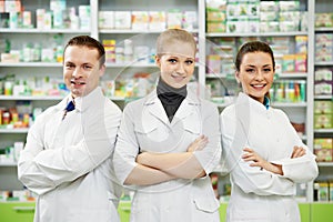 Pharmacy chemist team women and man in drugstore photo