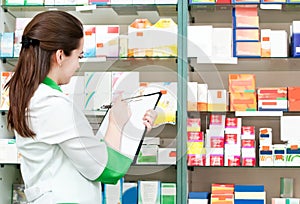 Pharmacy chemist woman in drugstore