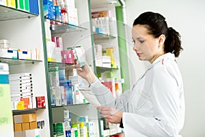 Pharmacy chemist woman in drugstore