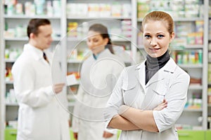 Pharmacy chemist woman in drugstore photo