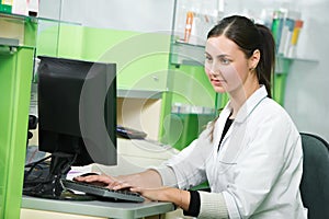 Pharmacy chemist woman in drugstore photo