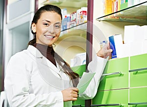 Pharmacy chemist woman in drugstore photo
