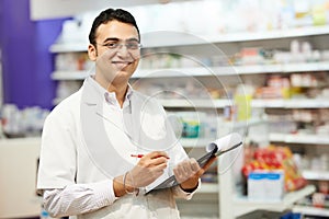 Pharmacy chemist woman in drugstore