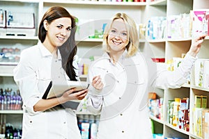 Pharmacy chemist women in drugstore