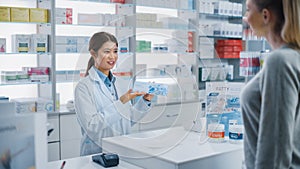 Pharmacy Drugstore Checkout Cashier Counter: Professional Asian Female Pharmacist Recommends