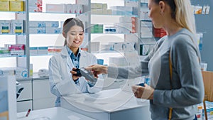 Pharmacy Drugstore Checkout Cashier Counter: Professional Asian Female Pharmacist Recommends