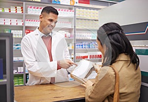 Pharmacy, medication and pharmacist explaining a prescription to a female patient in a chemist. Pharmaceutical