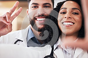 Pharmacy, peace sign and selfie portrait of pharmacists for social media, profile picture and clinic website. Healthcare