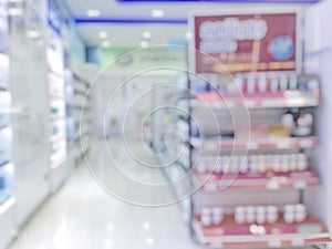 Pharmacy store or drugstore blur background with drug shelf and blurry pharmaceutical products, cosmetic and medication supplies