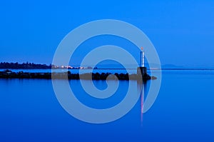 Pharos on sea shore at blue time