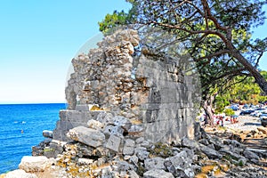 Phaselis invites tourists to enjoy swimming under pine trees on its coasts located right next to historic artifacts. Antalya-Turk
