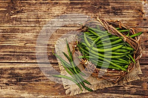 Phaseolus vulgaris, green common bean in wicker basket