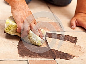 Phases of installing ceramic floor tiling - the joint material