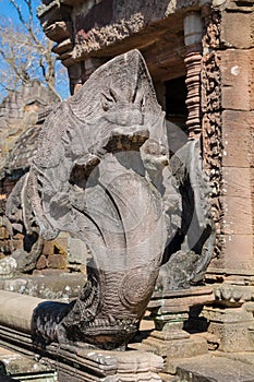 Serpent-like snake creature Phaya Naga statue in khmer ruins wat