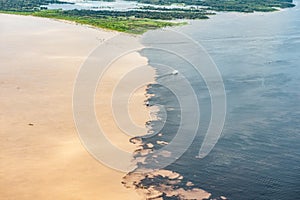 Phenomenon of Amazon - meeting of the waters - aerial view with two steamboats photo