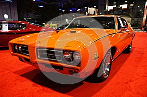 Philadelphia, Pennsylvania, U.S - January 14, 2024 - The side view of the red color 1969 Pontiac GTO The Judge sports car