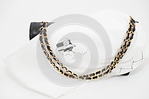 Photo of black Chanel handbag brand Editorial on white background.